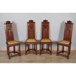 Four Renaissance-style chairs
